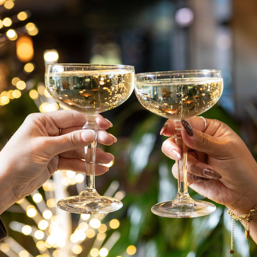 signature cocktail drinks with festive background at fora chicago the emily hotel fulton market